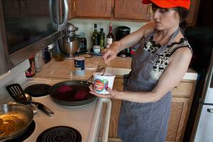 Anna Zefferys, Founder of Barts Better Food cooks the plant-based meat alternative into a burger.                                Photo by Brandon Taylor