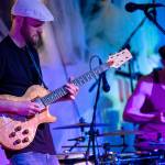 Photo by Daniel Hale                                Guitarist Eric Conn performs during a New Years Eve show at Bayview Hall. His guitar is homemade, built from wood from the Pacific Northwest.