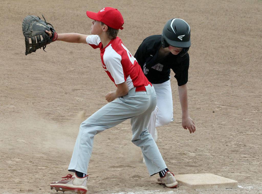 Coupeville first baseman Landon Roberts waits for a pickoff throw Thursday.(Photo by Jim Waller/Whidbey News-Times)