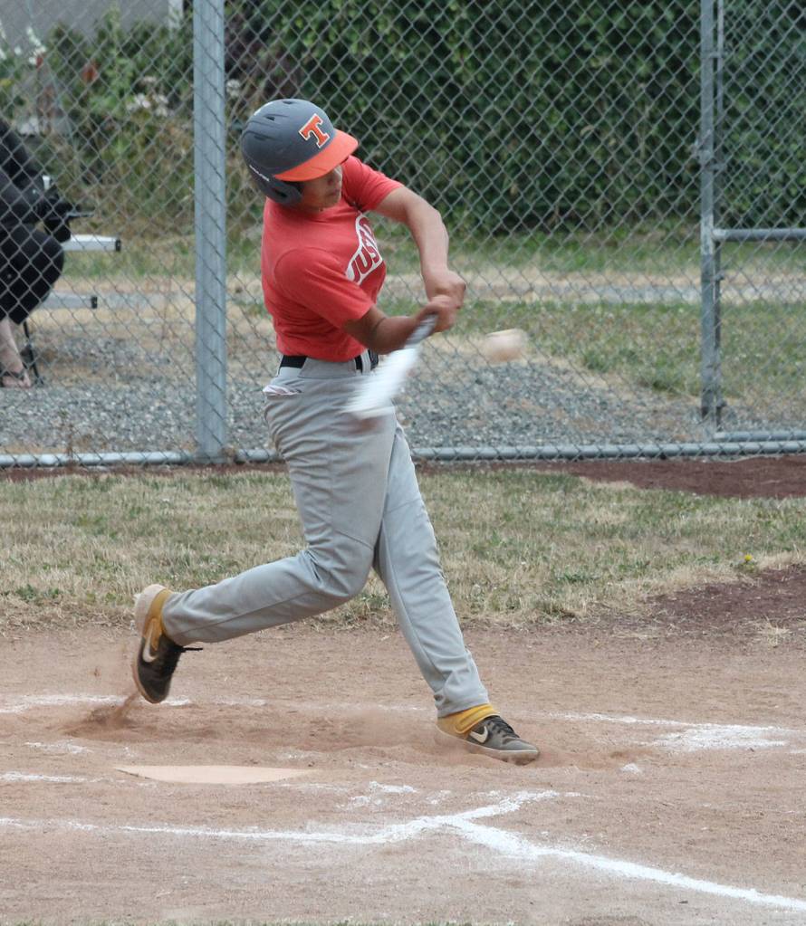 Coupevilles John Valenzuela drives an Anacortes pitch.(Photo by Jim Waller/Whidbey News-Times)
