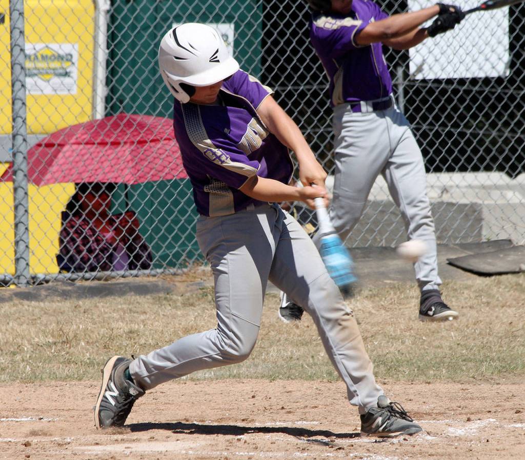 Oak Harbors Connor Cash rips a double in Saturdays game. (Photo by Jim Waller/Whidbey News-Times)