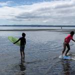 Students skimboard at Double Bluff.                                Photo by Emily Gilbert/Whidbey News-Times.