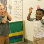 Lincoln Fresch, left, and Quintarius Eaves clap the sillies out during song time at Little Oaks Preschool & Childcare Center. Photo by Kira Erickson/Whidbey News Group.