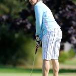 Mimi Boomersbach scopes out a putt in the par-3 tournament. (Photo by John Fisken)