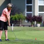Celia Horton strokes a long putt in last weeks match. (Photo by John Fisken)