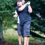Tim Grove watches his shot head to the green. (Photo by John Fisken)