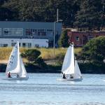 New Wildcat Sailing coach Shawn OConnor, left, instructs his team during a recent practice. (Photo by John Fisken)