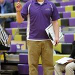 Eric Collins directs his players at a past basketball game. Collins is the new varsity coach of the Oak Harbor High School girls team. (Photo by John Fisken)