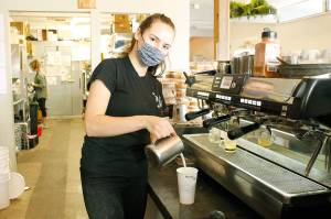Photo by Kira Erickson/Whidbey News Group
Annalise Litchard, a barista at Rock Island Coffee, prepares a latte for a customer. The Oak Harbor coffee shop is closing on Halloween. Staff will be relocating to Sunshine Drip in Coupeville, Rock Islands sister store.