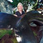 Photo by Olivia Vanni/The Herald
Georgia Gerber with her whale statue on display along First Street in Langley.