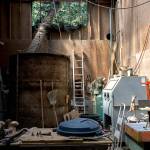 At far right, a statue of a rabbit dancing on a turtle sits on a workbench at Georgia Gerbers home in Clinton. (Olivia Vanni / The Herald)