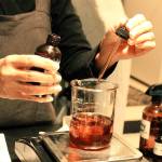 Karen Wilson adds to the palo santo blend of oils. Photo by Kira Erickson/Whidbey News-Times