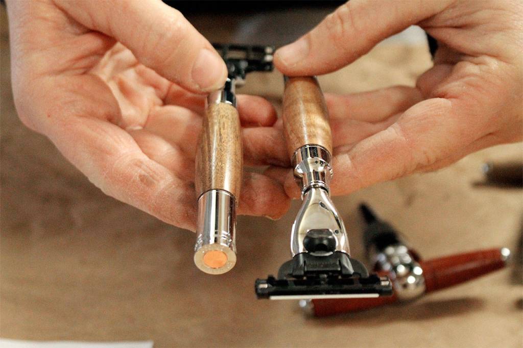 Amber Hawkins shows off two completed razors. Photo by Kira Erickson/Whidbey News-Times