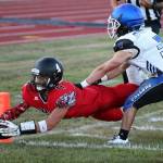 Hunter Smith dives into the end zone for a Coupeville touchdown in 2016. (Photo by John Fisken)