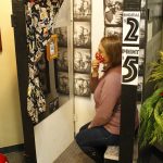 Jamie Farage demonstrating how the photo booth works at Whidbey Artists Collective in Clinton. Photo by Kira Erickson/Whidbey News-Times