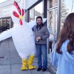 The Whidbey Island Chicken has become somewhat of a local celebrity in recent months, with many fans like Fernando Duran asking for a picture whenever they catch a glimpse. Photo by Emily Gilbert/Whidbey News-Times
