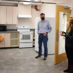 State Rep. Dave Paul, D-Oak Harbor, talks to Boys and Girls Club of Oak Harbor Unit Director Nikki Barone about some of the new ways the club will be able to teach kids kitchen skills in its new building on Ely Street. Photo by Emily Gilbert/Whidbey News-Times