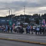 On Wednesday, Trump supporters gather at the intersection of Highway 20 and Southeast Pioneer Way in Oak Harbor to show their support for the outgoing president, and to protest the election of Joe Biden The event coincided with the storming of the U.S. Capitol by other President Donald Trump supporters. Photo by Emily Gilbert/Whidbey News-Times