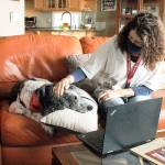 Greenbank resident LouAnn Hepp prepares her parti poodle, Ruby, for a Reading with Rover online session. The pair have been part of the Puget Sound literacy program for the past several years and transitioned from in-person to virtual events. Photo by Kira Erickson/Whidbey News-Times