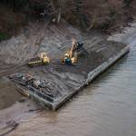 Dirt is moved during the deconstruction of a seawall north of Langley on Whidbey Island. (Olivia Vanni / The Herald)