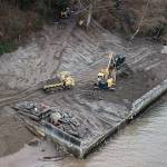 Dirt is moved during the deconstruction of a seawall on Friday, Jan. 29, 2020 in Langley, Wa. Shoreline restoration underway north of Langley involves removal of an old barge and bulkheads. Sea level rise makes such habitat improvements all the more important to endangered salmon and their prey. The project is a partnership between Seahorse Siesta property owners and the Northwest Straits Foundation. (Olivia Vanni / The Herald)