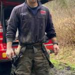 North Whidbey Fire and Rescue Lt. Micheal Maletto helped rescuers and the girl return to dry land after she was freed from the mud on Sunday at Dugualla State Park. Photo by Lolly Laura Titherington