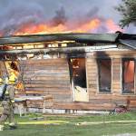 Multiple agencies responded to a house fire on Swantown Road in Oak Harbor Friday morning. North Whidbey Fire and Rescue Chief John Clark said the cause is still under investigation, but did not appear to be suspicious. Photo by John Fisken