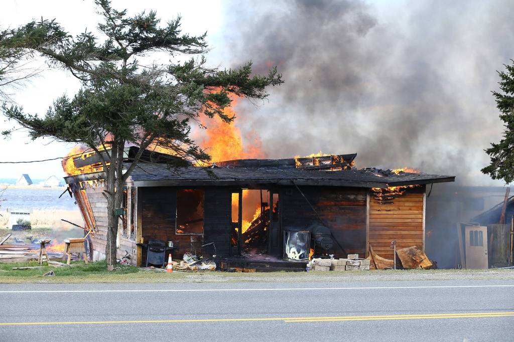 Multiple agencies responded to a house fire on Swantown Road in Oak Harbor Friday morning. North Whidbey Fire and Rescue Chief John Clark said the cause is still under investigation, but did not appear to be suspicious. Photo by John Fisken