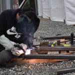 Photo by Emily Gilbert/Whidbey News-Times Junior Michael McKinney uses an arc welder to make a trailer hitch for a shed the class is making.
