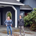 Whidbey Homeless Coalition leaders Katie Watkins and Jonathan Kline stand in front of the organizations proposed shelter on Morris Road outside of Coupeville. Photo by Emily Gilbert/Whidbey News-Times