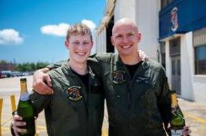 Lt. j.g. William McIlvaine, left, celebrates after graduating from flight school. McIlvaines uncle has donated a monument in his nephews honor after he was killed in 2013. Photo courtesy Phelps McIlvaine