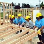 A group of women raise a wall for Habitat for Humanity of Island Countys two townhomes on Southeast 10th Avenue in Oak Harbor during the Women Build event Saturday. Photo by Emily Gilbert/Whidbey News-Times