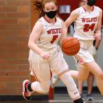 Eighth grader Savina Wells, right, plays alongside high school teammate Maddie Georges. (Photo by John Fisken/Whidbey News-Times)