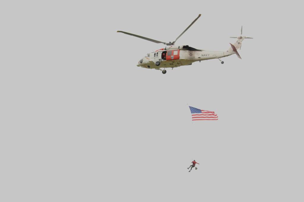 H-60 Search and Rescue does a flyover following the service.