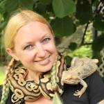 Amanda Ferrara poses with ball python Lemon and bearded dragon Drogon. (Photo by Karina Andrew/Whidbey News-Times)