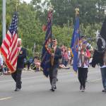 A local Veterans of Foreign Wars chapter carries flags in the parade. (Photo by Karina Andrew/Whidbey News-Times)
