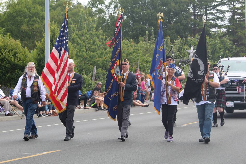 A local Veterans of Foreign Wars chapter carries flags in the parade. (Photo by Karina Andrew/Whidbey News-Times)
