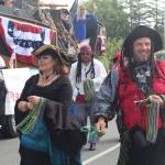 People dressed as pirates pass out beads to the crowd. (Photo by Karina Andrew/Whidbey News-Times)