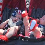 Two star-spangled babies are wheeled in the parade. (Photo by Karina Andrew/Whidbey News-Times)