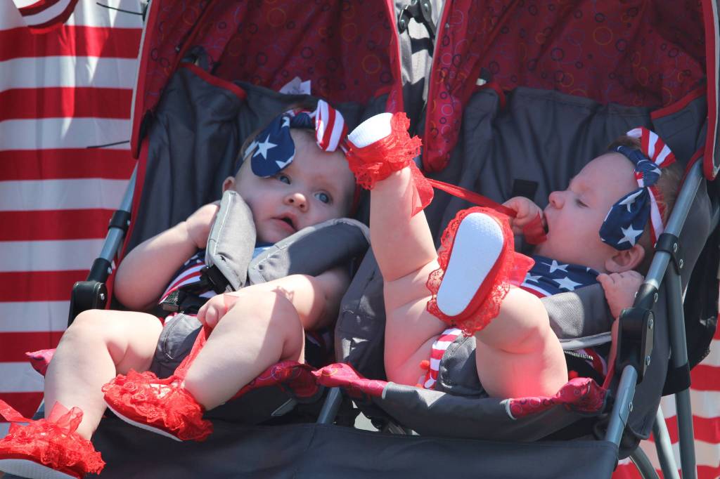 Two star-spangled babies are wheeled in the parade. (Photo by Karina Andrew/Whidbey News-Times)
