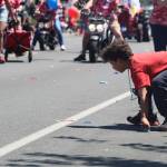 A youngster collects candy tossed to the crowd by parade participants. (Photo by Karina Andrew/Whidbey News-Times)