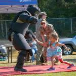 190704-N-HC646-0252 OAK HARBOR, Wash. (August 6, 2019) Master-at-Arms 1st Class Nick Fortune gives instruction during a take down demonstration to visitors in attendance of National Night Out on Fort Nugent Park. National Night Out is an annual community-building campaign that promotes police-community partnerships and neighborhood camaraderie. (U.S. Navy photo by Mass Communication Specialist 2nd Class Marc Cuenca/Released)