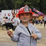 Carter Jones, 2, dances and sways to the music of a cover band performing on the main stage at the fair. (Photo by Kira Erickson/South Whidbey Record)