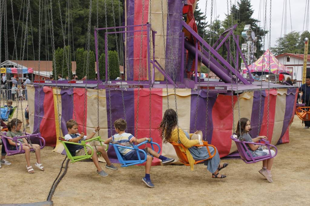 Adults and children alike get ready to ride the Yo-Yo at the fair. (Photo by Kira Erickson/South Whidbey Record)
