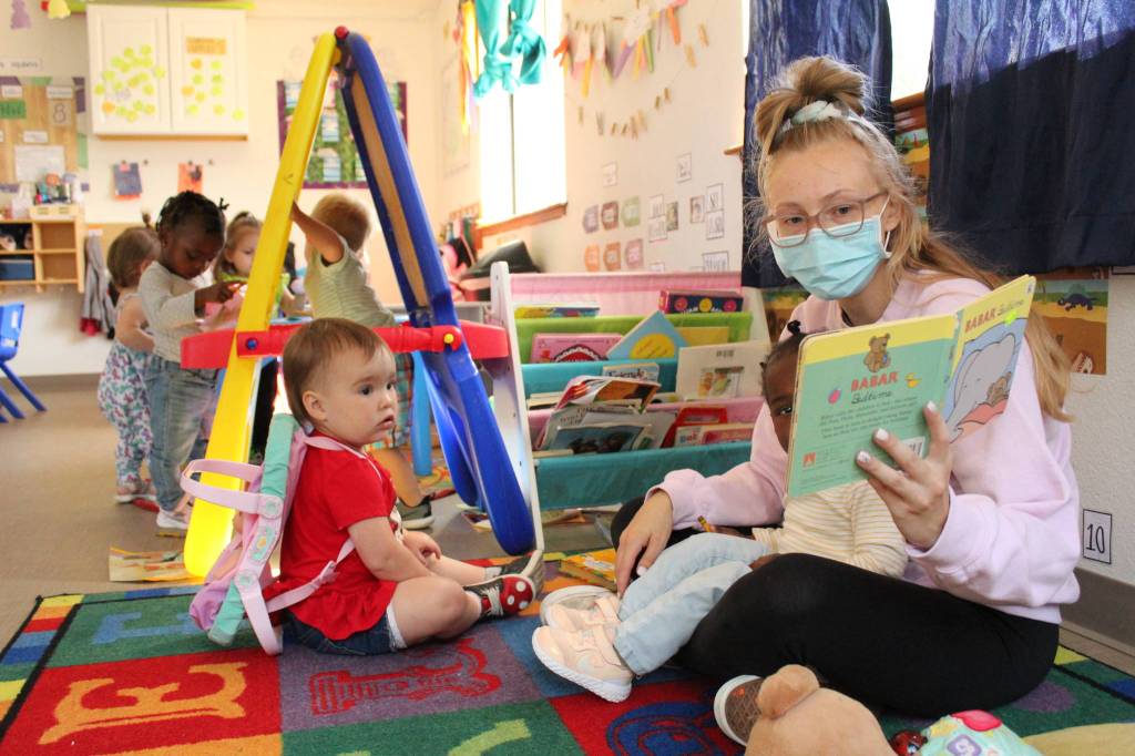 Little Oaks Preschool teacher Ashley Kulka reads to the toddler class. (Karina Andrew/Whidbey News-Times)