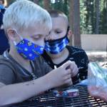 Photo by Emily Gilbert/Whidbey News-Times
Toby Grubbs and Dallas Owen work on eye spy bottles during a summer program at Olympic View Elementary in Oak Harbor.