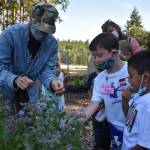 Photo by Emily Gilbert/Whidbey News-Times
Incoming first grade students got a taste of gardening by sampling borage flowers during a summer learning program at Olympic View Elementary in Oak Harbor on Wednesday.