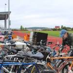 Photo by Karina Andrew/Whidbey News-Times
Coupeville Lions Club member Gary Parker locks up bikes to be sold at the garage sale this weekend.