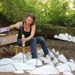 Jenni Ward installs the more than 300 pieces of Spore Patterns by hand at the Price Sculpture Forest. (Photo by Karina Andrew/Whidbey News-Times)