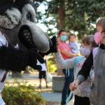 Photo by Karina Andrew/Whidbey News-Times
Students at Coupeville and Oak Harbor schools returned to class this week. Above, Matthew Richards, right, and Elizabeth Richards high five the wolf before going to find their classrooms at Coupeville Elementary.
